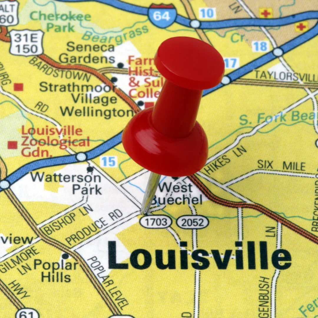 Red pushpin placed on a map of Louisville, Kentucky.